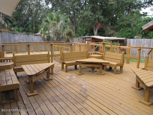 3245 Barkley Road Jacksonville, FL 32246 - Photo 10 of 11 an outdoor sitting area with furniture and wooden deck