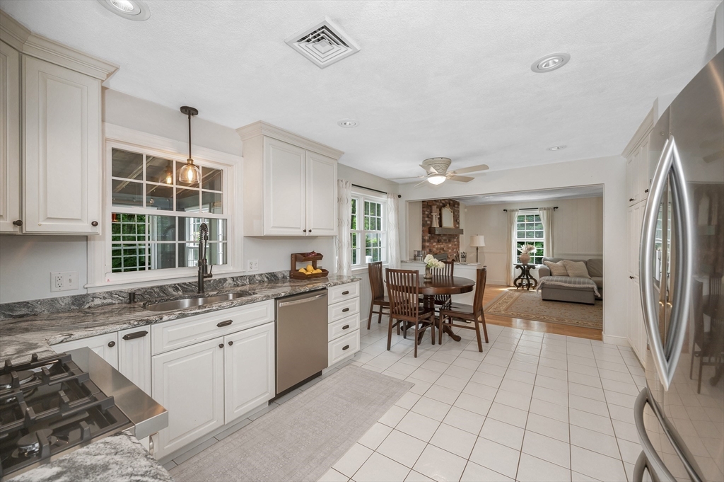 67 Reservation Road Andover, MA 01810 - Photo 11 of 40 a kitchen with sink cabinets and window