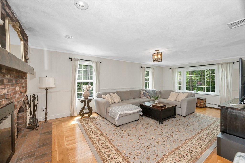 67 Reservation Road Andover, MA 01810 - Photo 15 of 40 a living room with furniture and a window