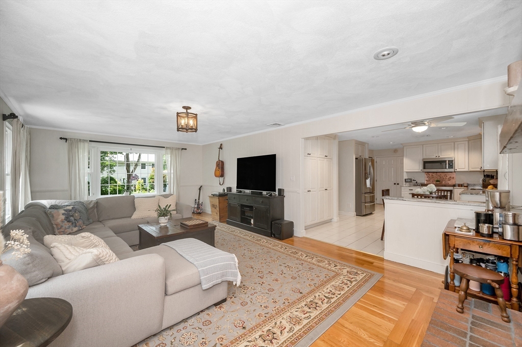 67 Reservation Road Andover, MA 01810 - Photo 17 of 40 a living room with furniture and a flat screen tv