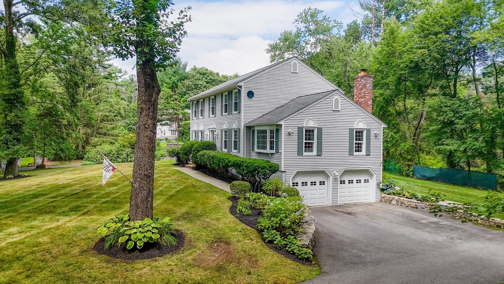 67 Reservation Road Andover, MA 01810 - Photo 2 of 40 a front view of a house with garden