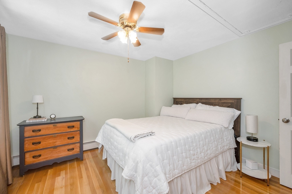 67 Reservation Road Andover, MA 01810 - Photo 23 of 40 a bedroom with a bed and a tv on a dresser