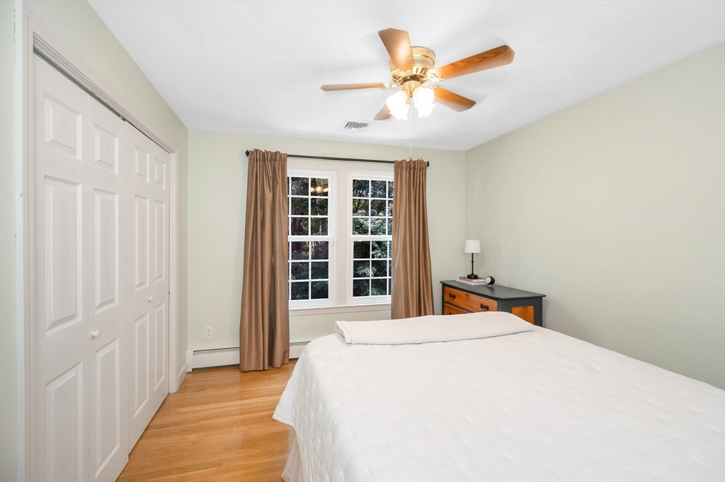 67 Reservation Road Andover, MA 01810 - Photo 24 of 40 a bedroom with a bed and a large window