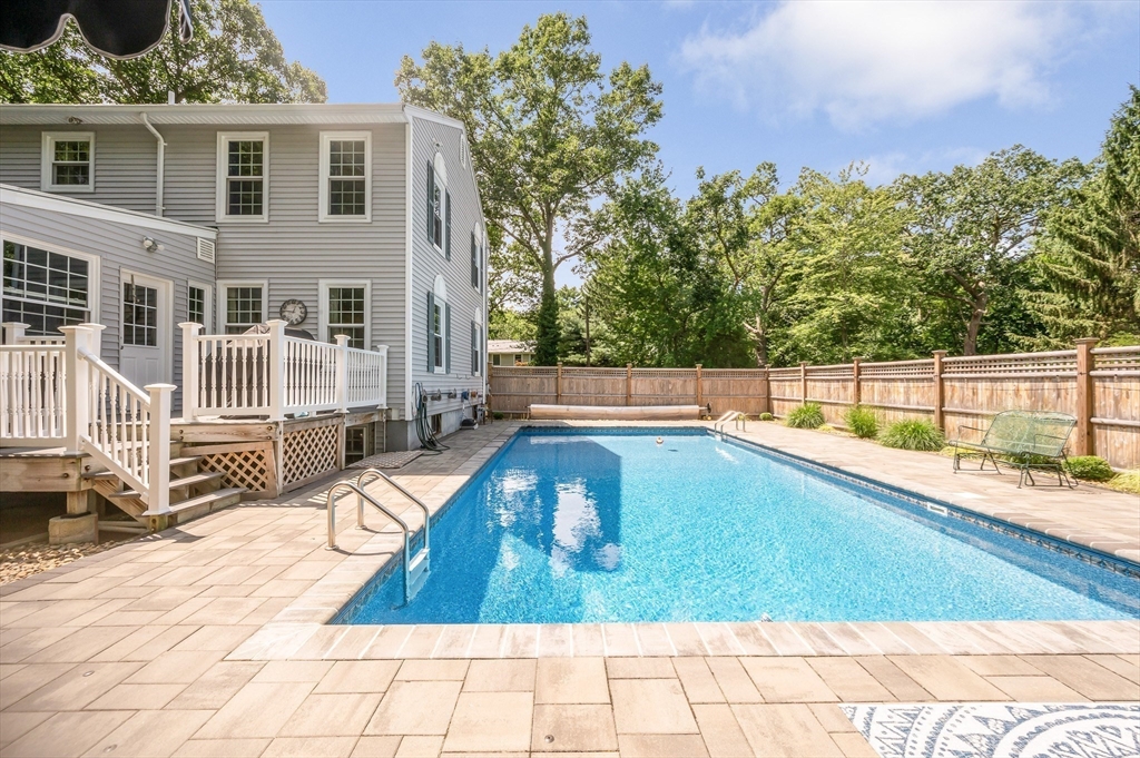 67 Reservation Road Andover, MA 01810 - Photo 35 of 40 a view of a swimming pool with a lounge chairs