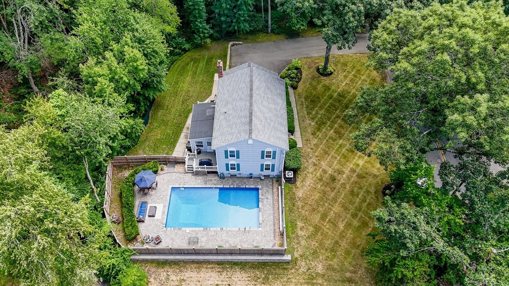 67 Reservation Road Andover, MA 01810 - Photo 38 of 40 an aerial view of a house with swimming pool and large trees
