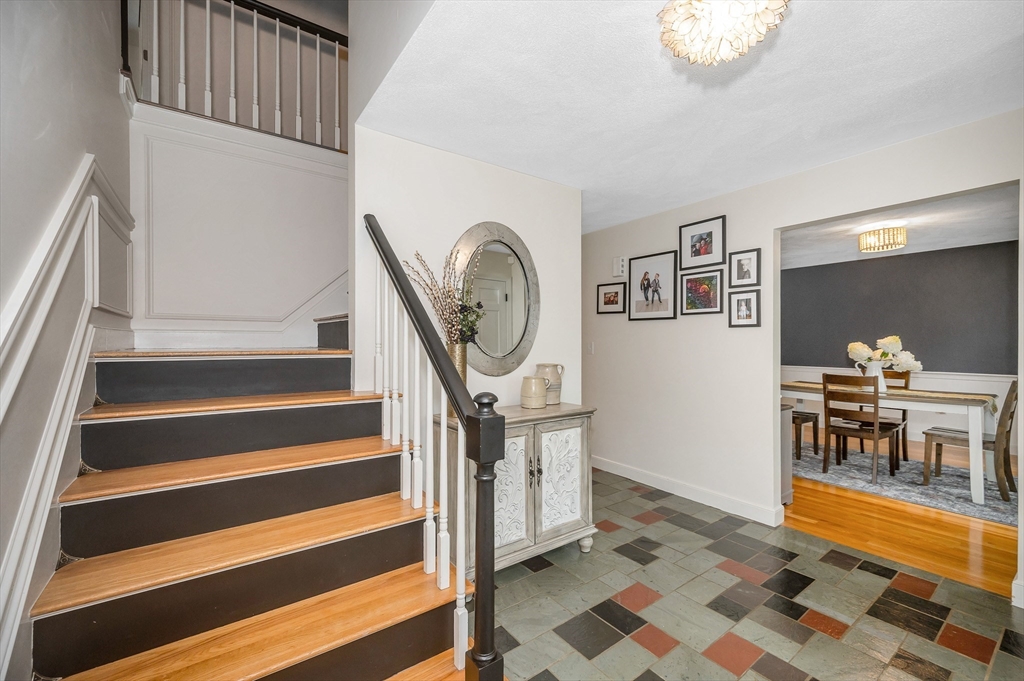 67 Reservation Road Andover, MA 01810 - Photo 4 of 40 a view of entryway and hall with wooden floor