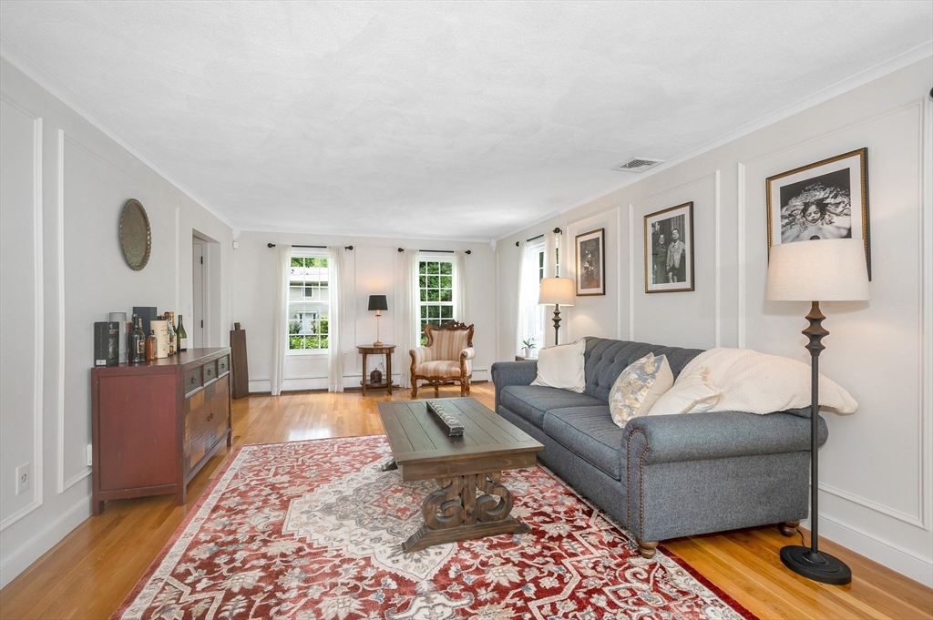 67 Reservation Road Andover, MA 01810 - Photo 7 of 40 a living room with furniture and a rug