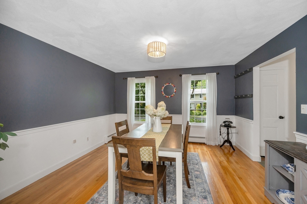 67 Reservation Road Andover, MA 01810 - Photo 10 of 40 a view of a dining room with furniture and a window