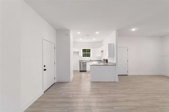 a view of kitchen with wooden floor