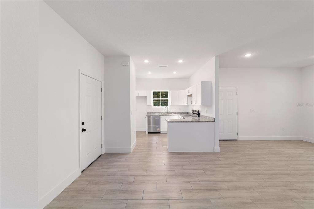 15431 Southwest 41st Street Road Ocala, FL 34481 - Photo 15 of 44 a view of kitchen with wooden floor