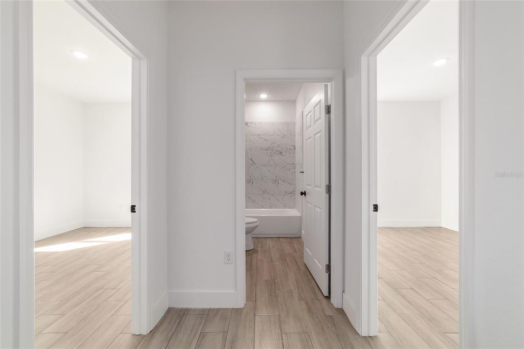 15431 Southwest 41st Street Road Ocala, FL 34481 - Photo 18 of 44 a view of a bathroom from the hallway