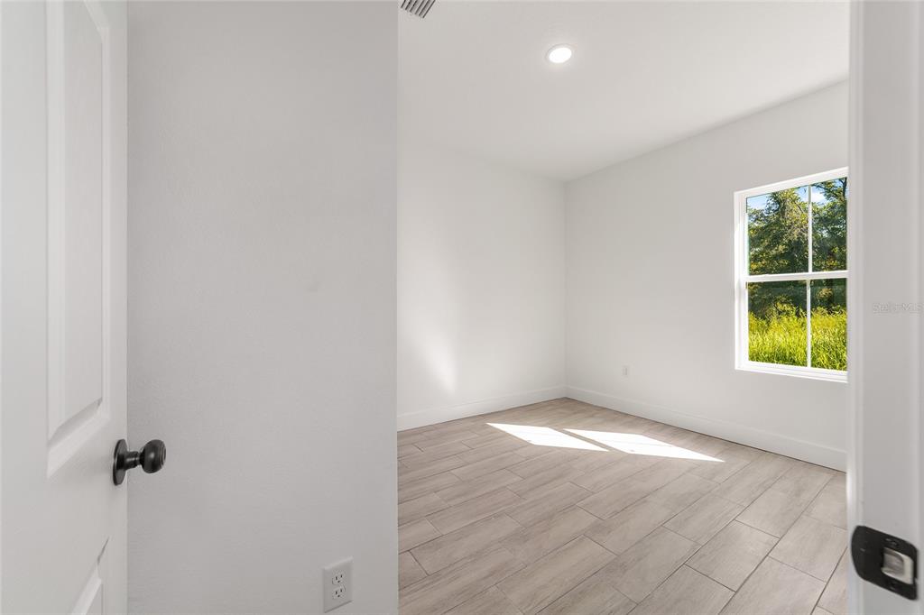 15431 Southwest 41st Street Road Ocala, FL 34481 - Photo 26 of 44 a view of an empty room with a window