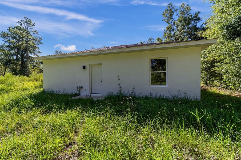 15431 Southwest 41st Street Road Ocala, FL 34481 - Photo 40 of 44 a view of a backyard