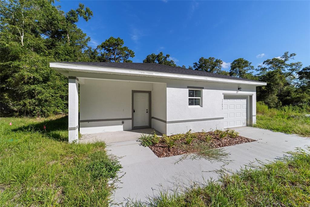 15431 Southwest 41st Street Road Ocala, FL 34481 - Photo 44 of 44 front view of a house with a yard