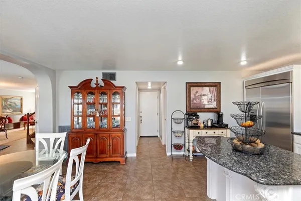a kitchen with a sink stove and refrigerator