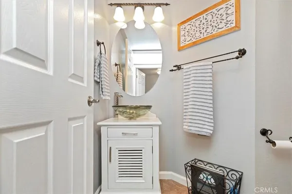 a bathroom with 2 sink and a mirror