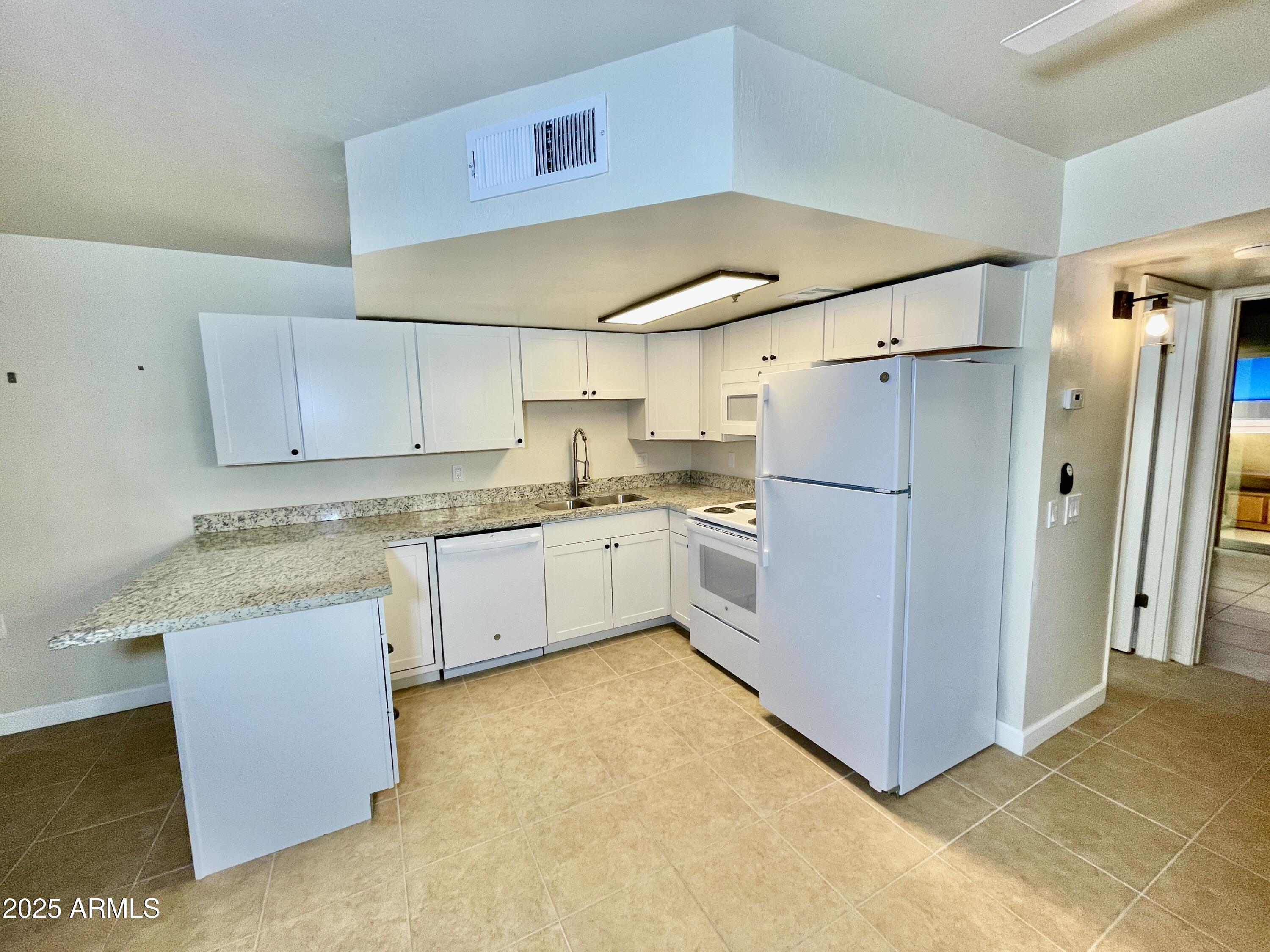 12221 West Bell Road, Unit 162 Surprise, AZ 85378 - Photo 14 of 36 Kitchen View 2