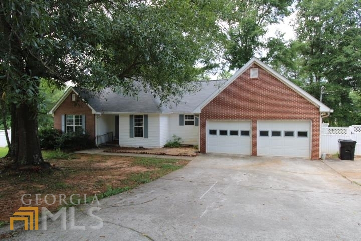 105 Hannah Street Barnesville, GA 30204 - Photo 1 of 1 a house with trees in the background