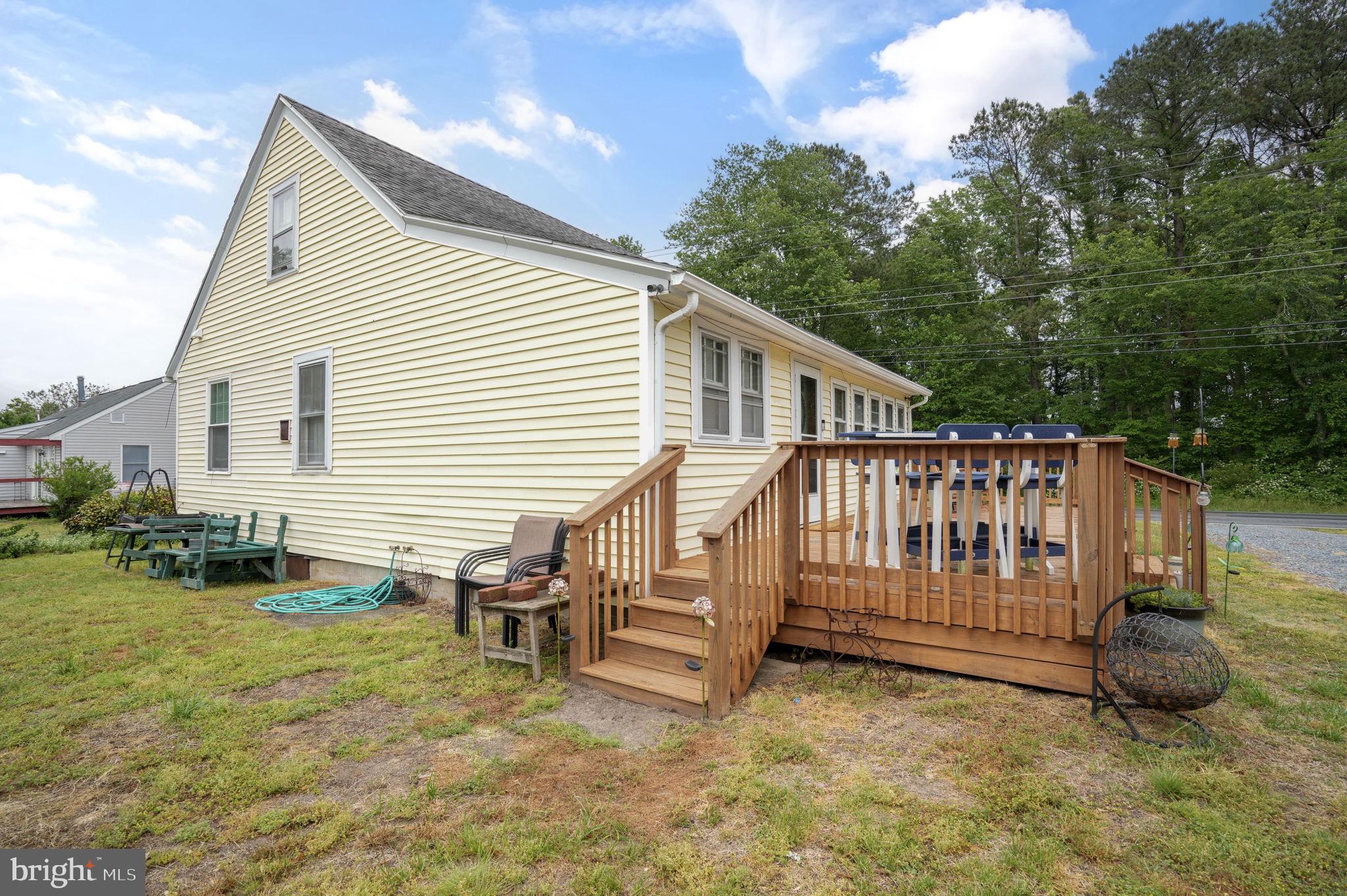 7278 Fleming Road New Church, VA 23415 - Photo 3 of 44 a view of a house with a yard