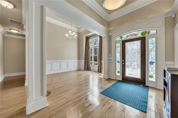a view of an entryway with wooden floor
