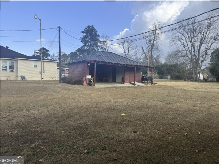 301 Church Street Vienna, GA 31092 - Photo 2 of 12 a view of a house with a yard