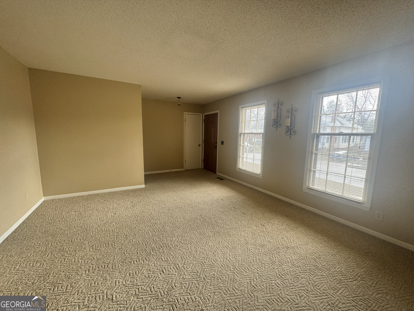 301 Church Street Vienna, GA 31092 - Photo 6 of 12 an empty room with windows