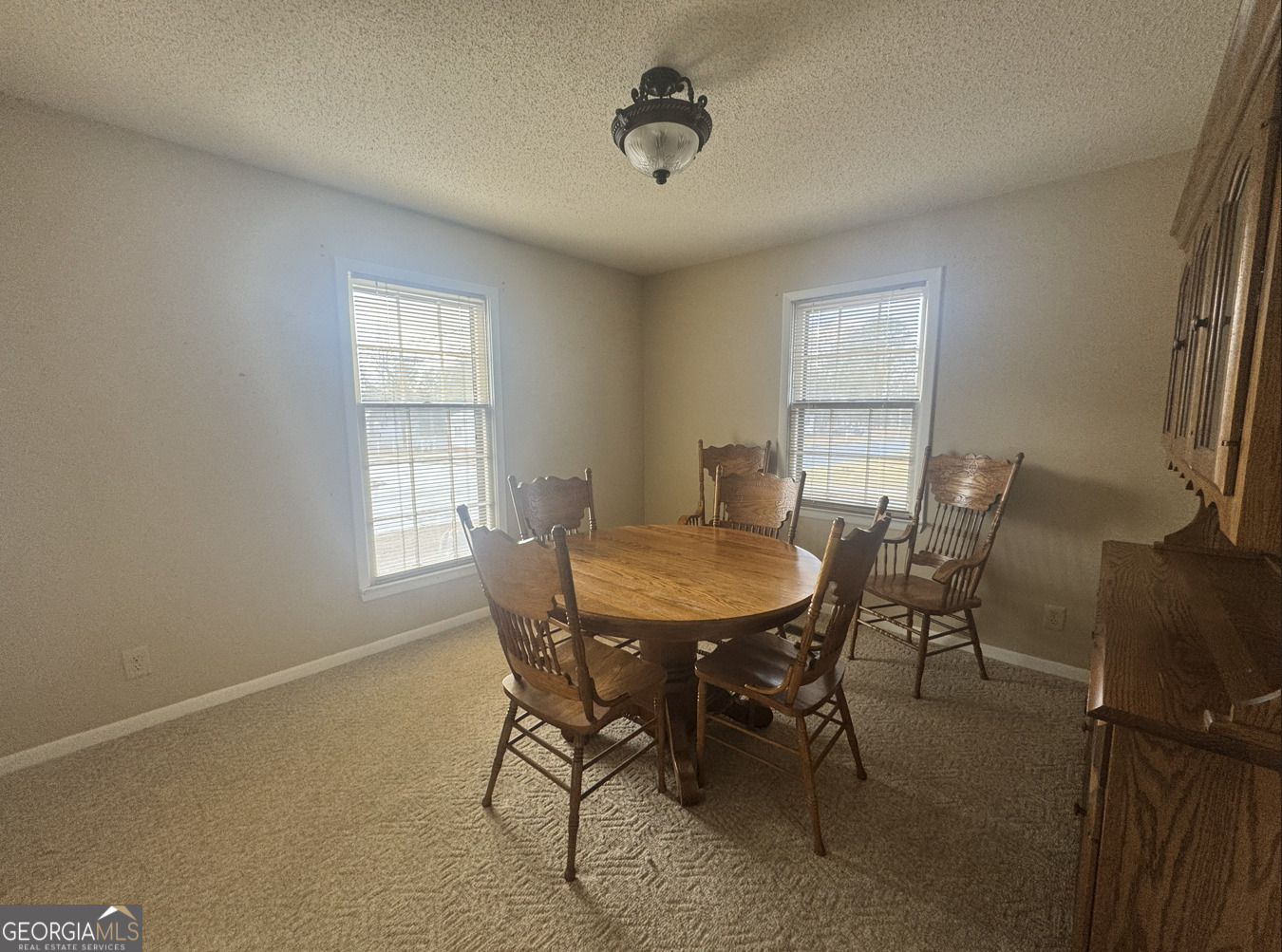 301 Church Street Vienna, GA 31092 - Photo 8 of 12 a view of a dining room with furniture and window