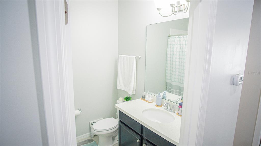 11636 Water Run Alley Windermere, FL 34786 - Photo 12 of 18 a bathroom with a sink toilet and a mirror