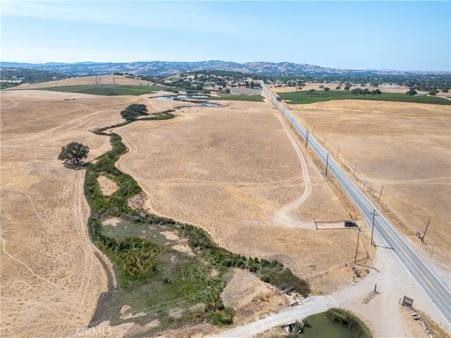 a view of beach and small yard