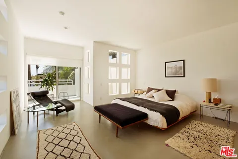 a bed room with a bed and a couch