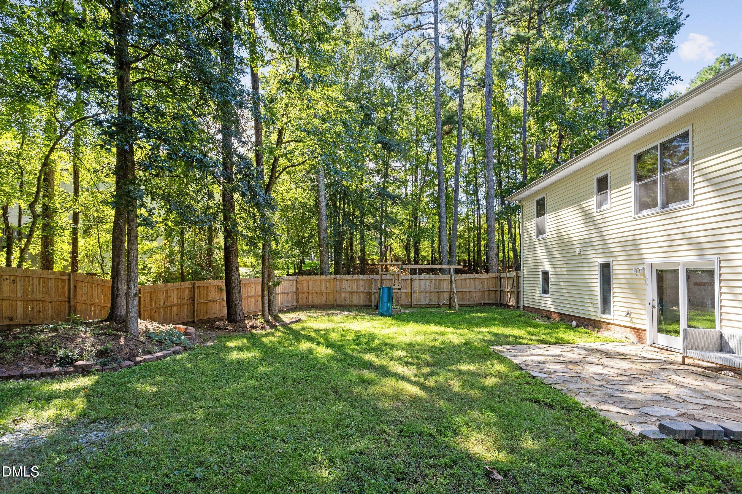 4409 Randall Road Durham, NC 27707 - Photo 8 of 33 Tall-Fenced in backyard with stone patio