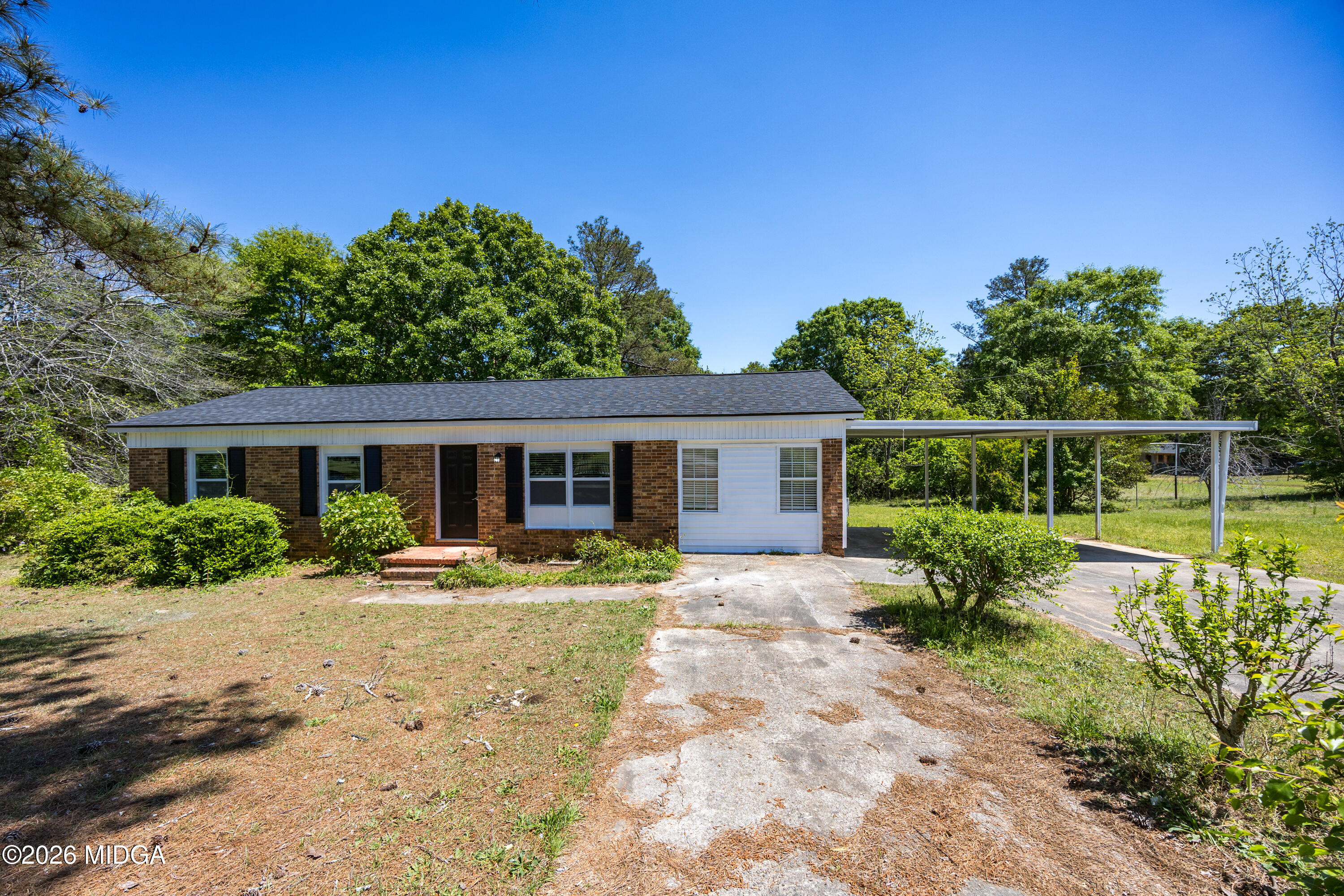 427 Gun Club Road Fort Valley, GA 31030 - Photo 25 of 26 a front view of a house with garden