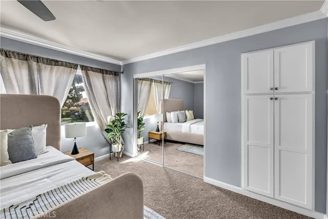 a bedroom with a bed and a couch