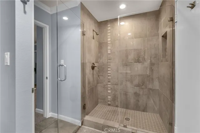 a bathroom with a shower and a sink