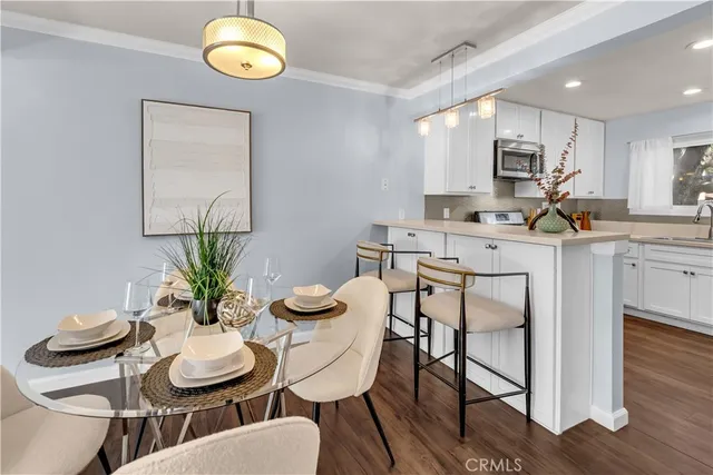 a kitchen with a table and chairs in it