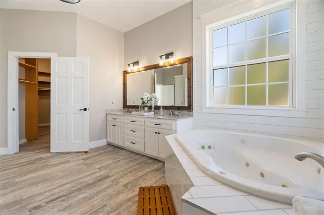 a bathroom with a bathtub and a sink