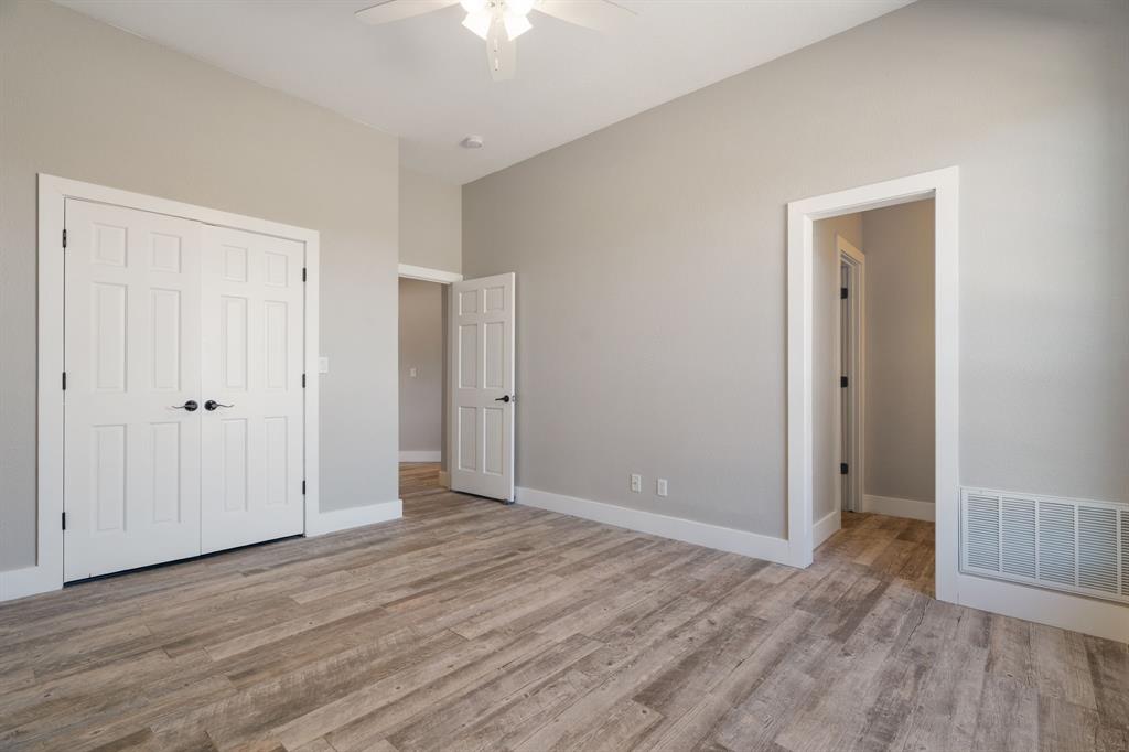 1943 Alsdorf Road Ennis, TX 75119 - Photo 19 of 38 a view of an empty room with wooden floor