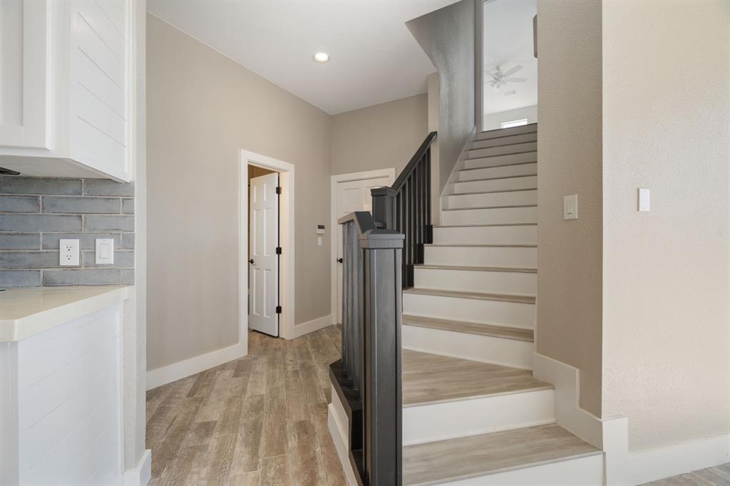 1943 Alsdorf Road Ennis, TX 75119 - Photo 23 of 38 a view of entryway with wooden floor and staircase