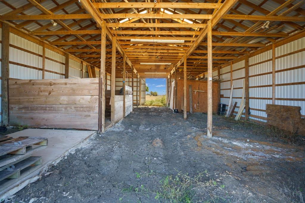 1943 Alsdorf Road Ennis, TX 75119 - Photo 31 of 38 a view of a room with wooden walls
