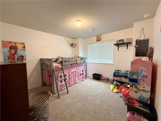 a bedroom with furniture and a bed