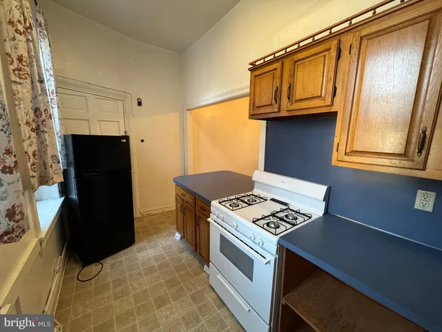 a kitchen with a stove and a microwave