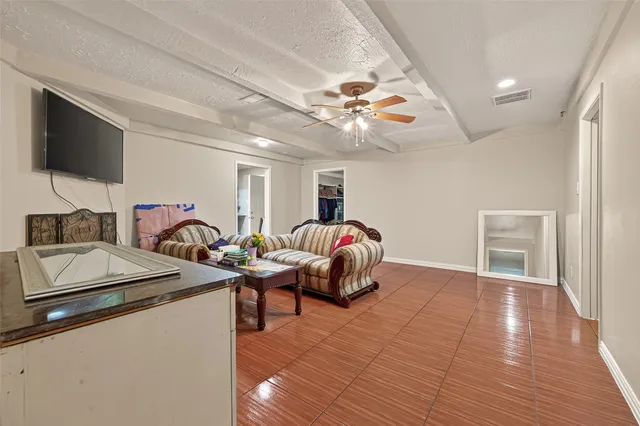 a bedroom with furniture and a chandelier