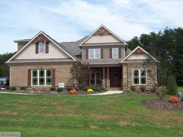 Exterior Front. Brick and stone exterior with cedar accents.