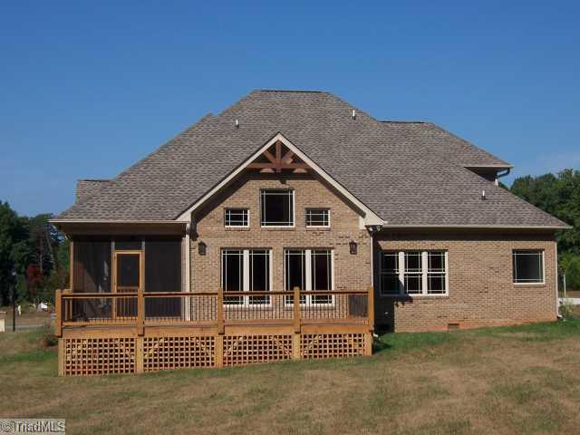 7776 Sutter Road Greensboro, NC 27455 - Photo 12 of 16 Exterior Back. Back view with Deck and Screened Porch