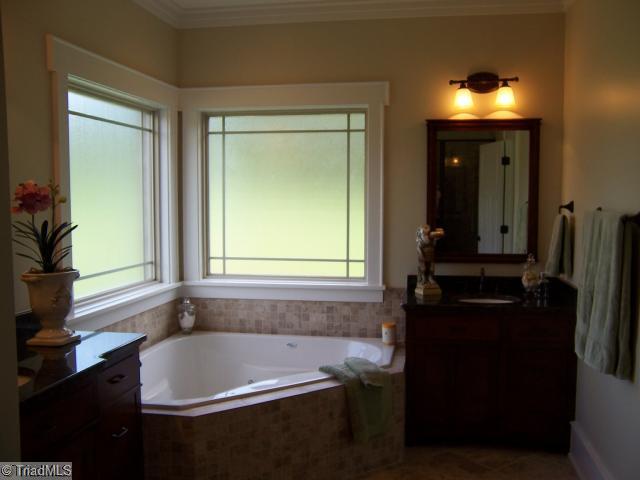 7776 Sutter Road Greensboro, NC 27455 - Photo 9 of 16 Master Bath/Spa. Master Bath has Custom vanities and matching mirrors