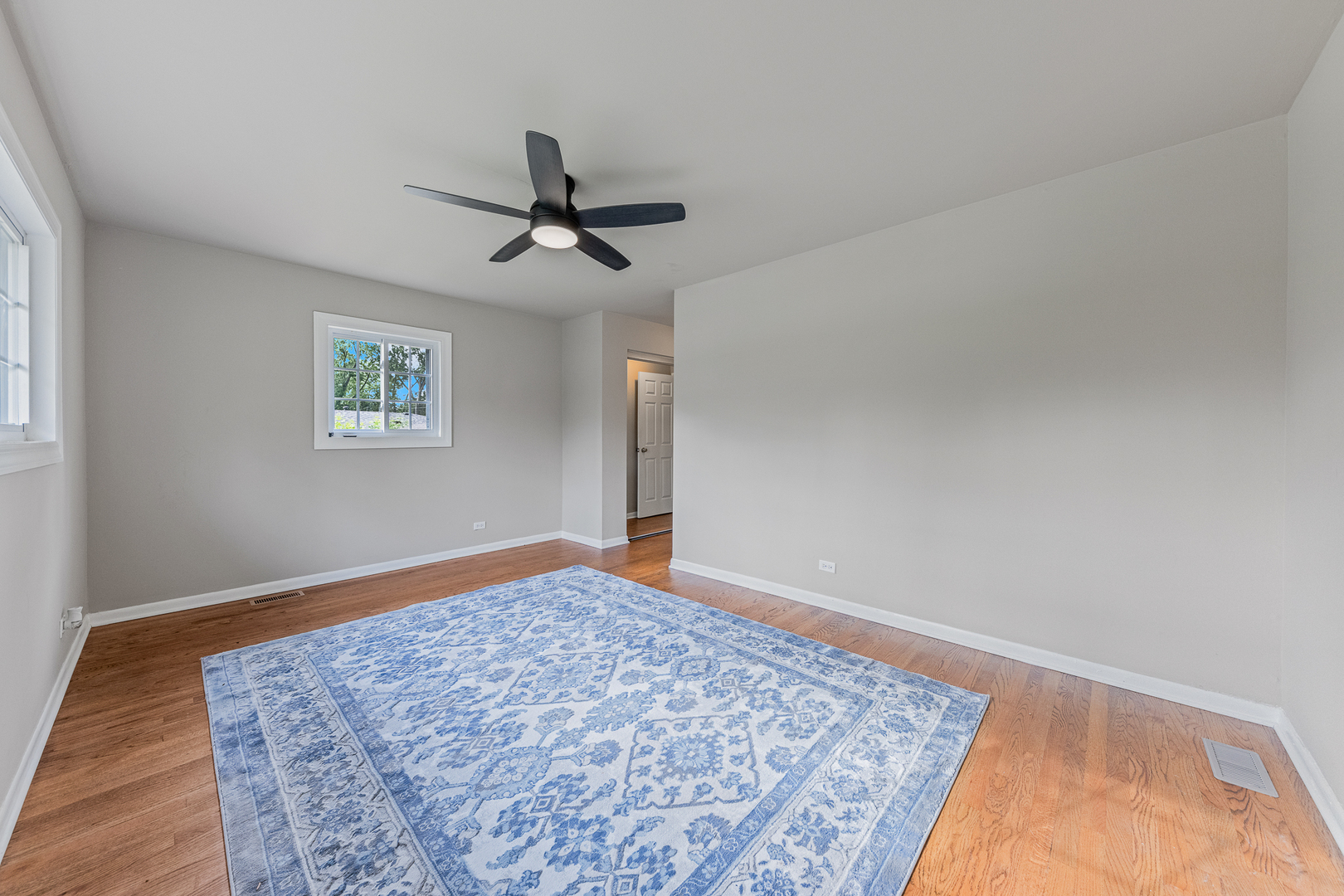 303 Springfield Street Park Forest, IL 60466 - Photo 7 of 16 a view of empty room with wooden floor