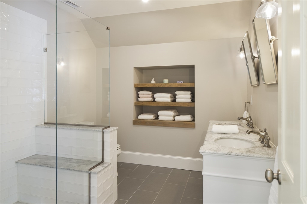 43 Oak Hill Road Harvard, MA 01451 - Photo 30 of 42 a bathroom with a granite countertop sink a mirror and shower