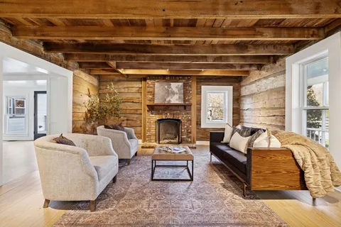 a front view of a house with a potted plant