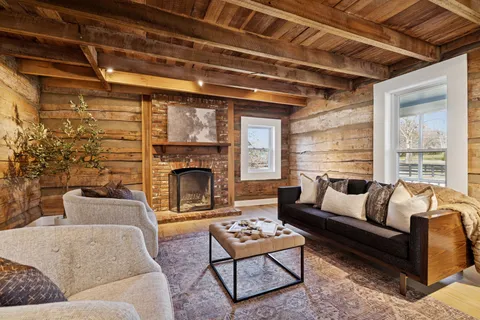 a living room with furniture and a table