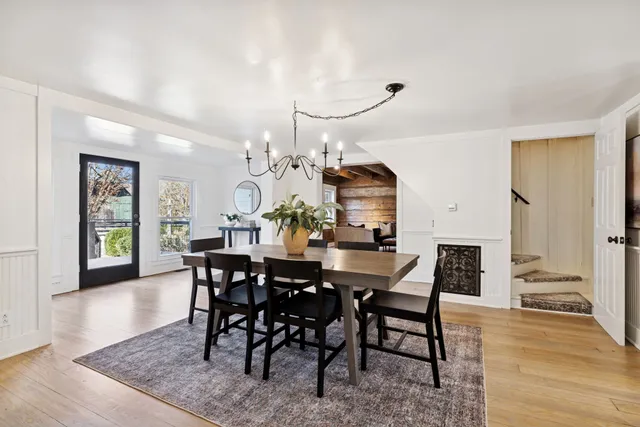 a kitchen with kitchen island granite countertop a sink cabinets and stainless steel appliances